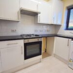 Kitchen with white goods in home for rent in Milton Keynes