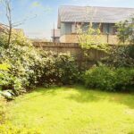 Private back garden with bushes in Milton Keynes rental property