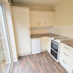 Kitchen with patio doors leading to garden in rental property Milton Keynes