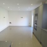 Spacious modern kitchen with grey cupboards