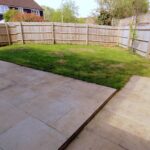 Patio of spacious back garden with gravel edge