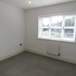 Bedroom with view of neighbouring houses