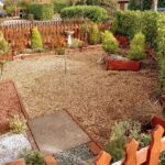 Back garden with pebbles and small pointed bushes in house to rent in Milton Keynes