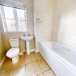 Bathroom with shower over bath in property for rent in Milton Keynes