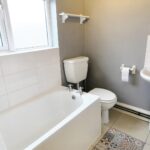 Bathroom with floor tile detail in house to rent near Milton Keynes