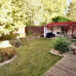 Well-maintained garden with covered seating area in Milton Keynes rental property