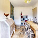 Dining area with wooden furniture in 3 bedroom property to rent in Milton Keynes